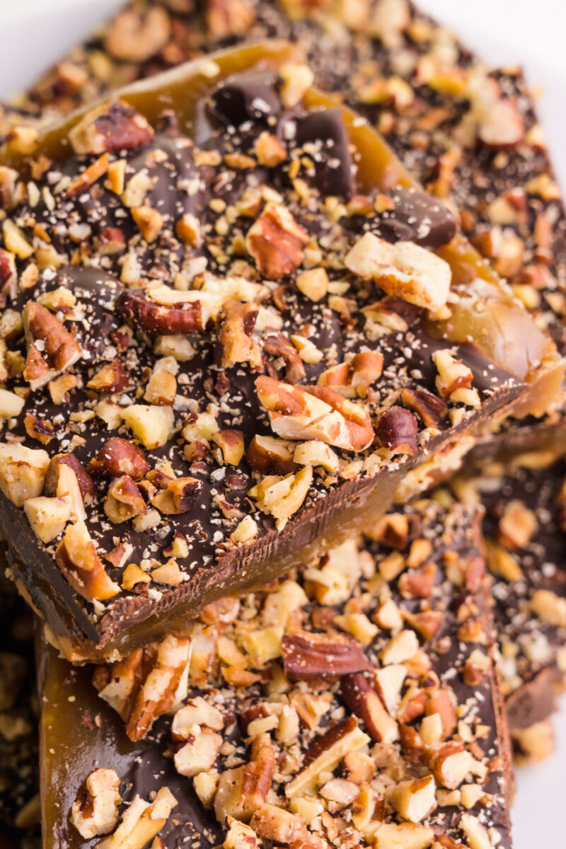 Looking down on chunks of dairy-free toffee sitting on a plate.