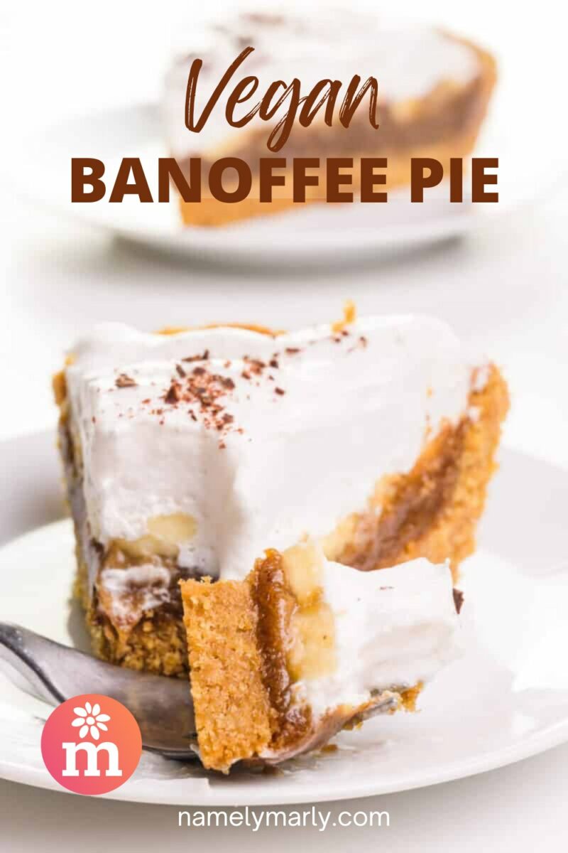 Vegan banoffee pie slice with whipped topping, banana, and golden crust on a white plate with a fork.