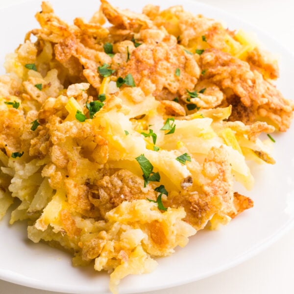 A closeup of vegan funeral potatoes on a plate.