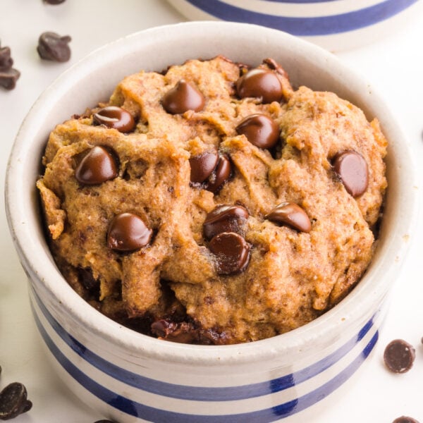 A closeup of a mug cookie in a bowl.