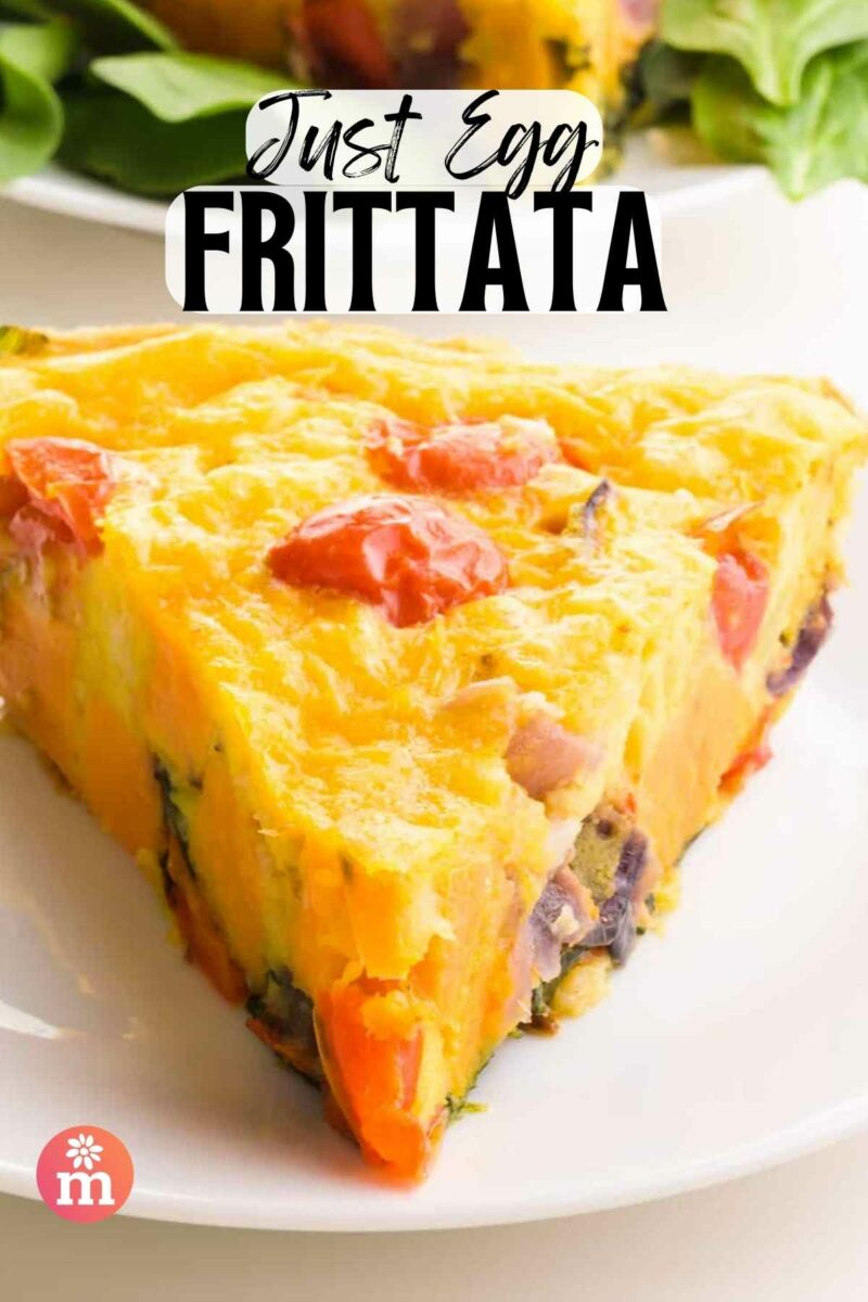 A slice of frittata sits on a plate. The text reads, Just Egg Frittata.