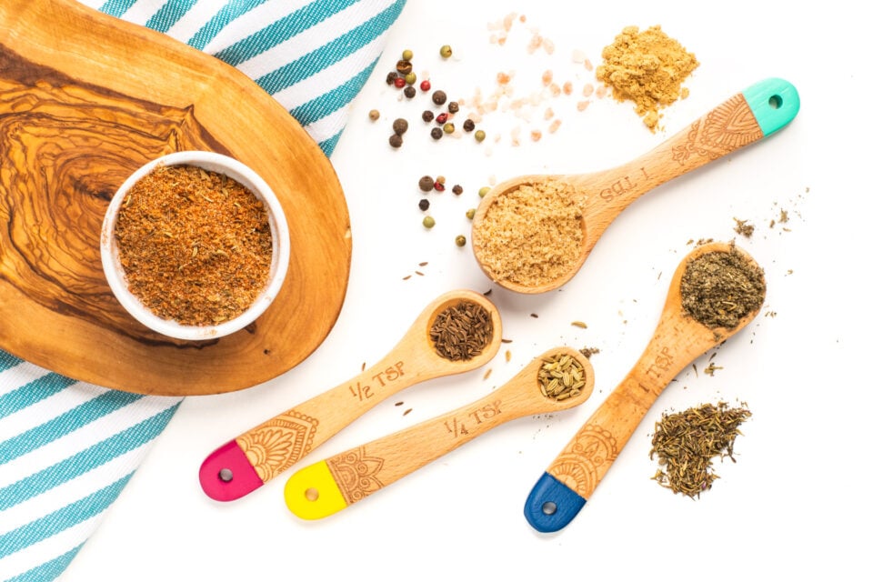 Looking down on spices in measuring spoons.