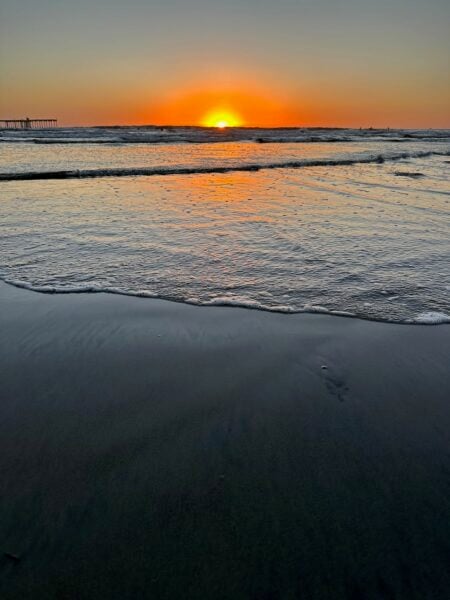 A photo of a setting sun over the Pacific Ocean.