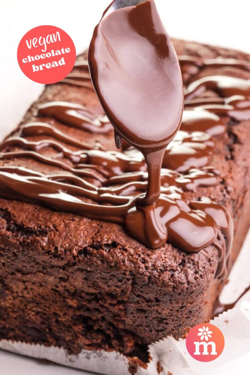 Vegan chocolate bread with chocolate drizzle, freshly baked and still warm.