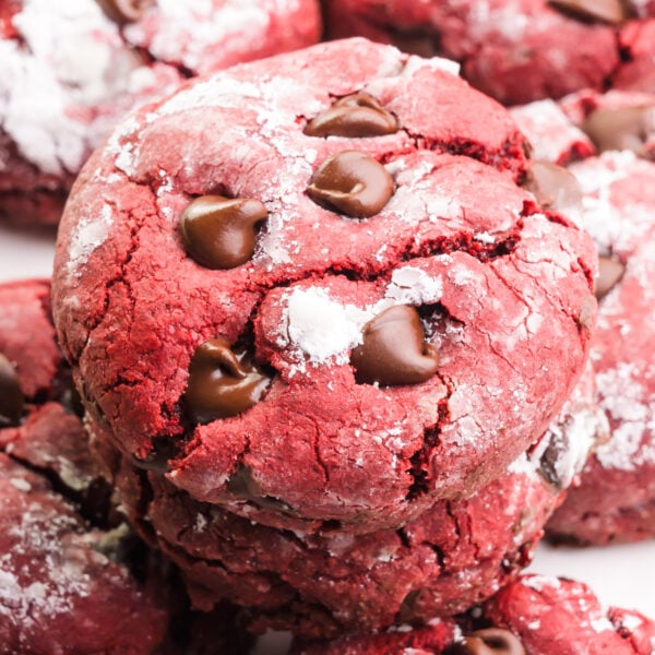 Looking down on vegan Red Velvet Cookies stacked with more cookies all around them.