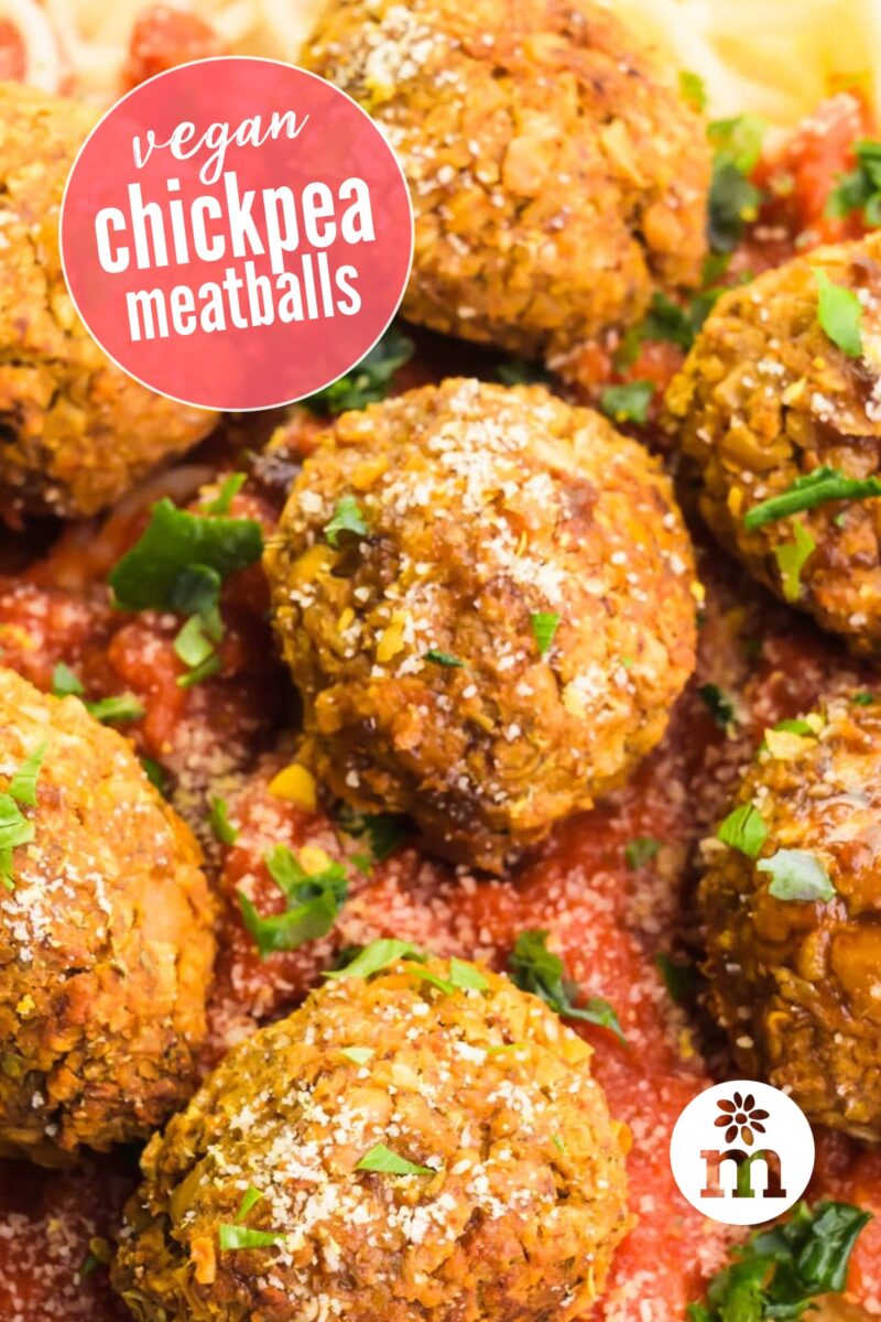 Looking down on meatballs in a bed of marinara sauce. The text reads, Vegan Chickpea Meatballs.