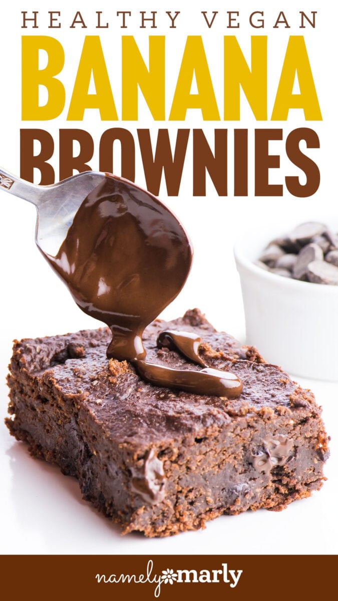 Healthy vegan banana brownies topped with melted chocolate and served with chocolate chips on the side.