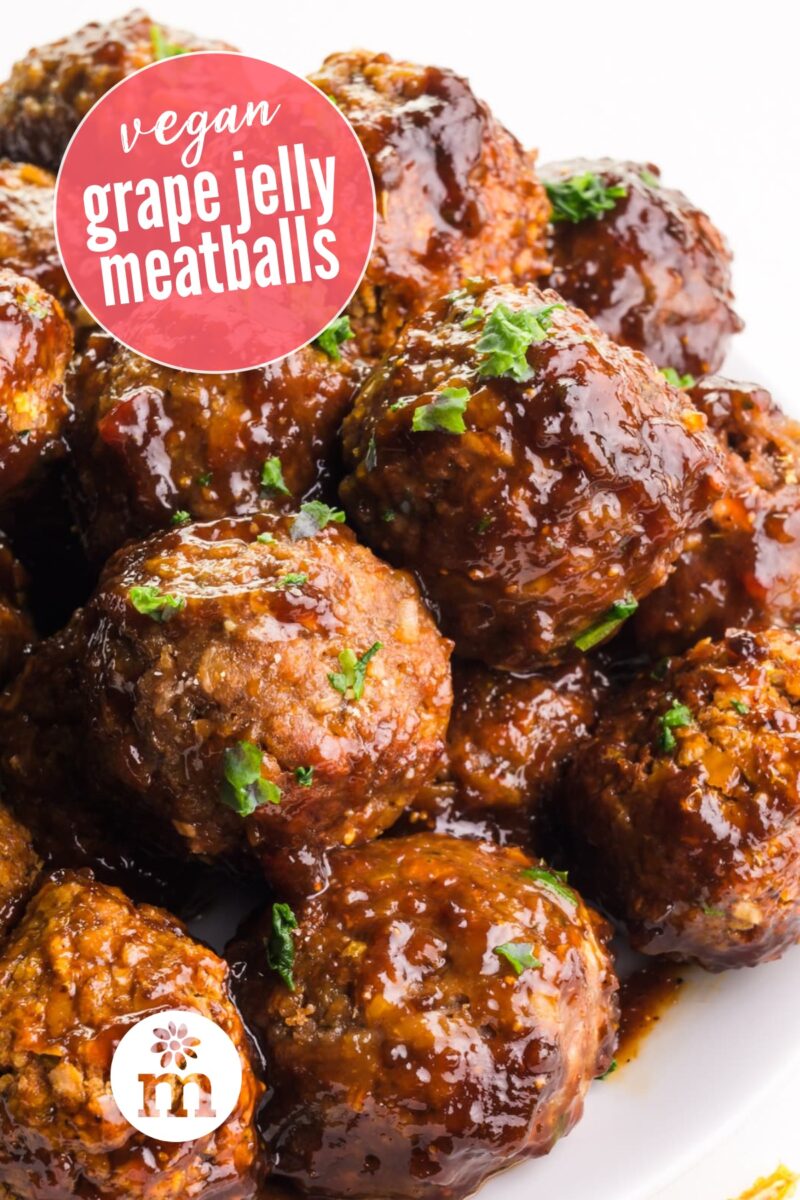A plate holds a stack of saucy meatballs. The text reads, vegan grape jelly meatballs.