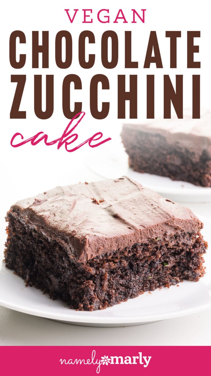 Vegan chocolate zucchini cake slice with chocolate frosting on a white plate.