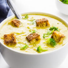 A close-up of a bowl of creamy broccoli soup.