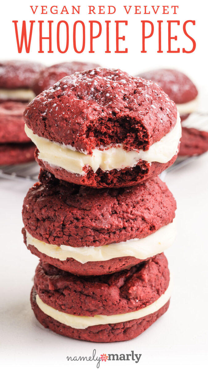 Vegan Red Velvet Whoopie Pies with image of a stack of vegan red velvet whoopee pies, shows the top one with a bite taken out.
