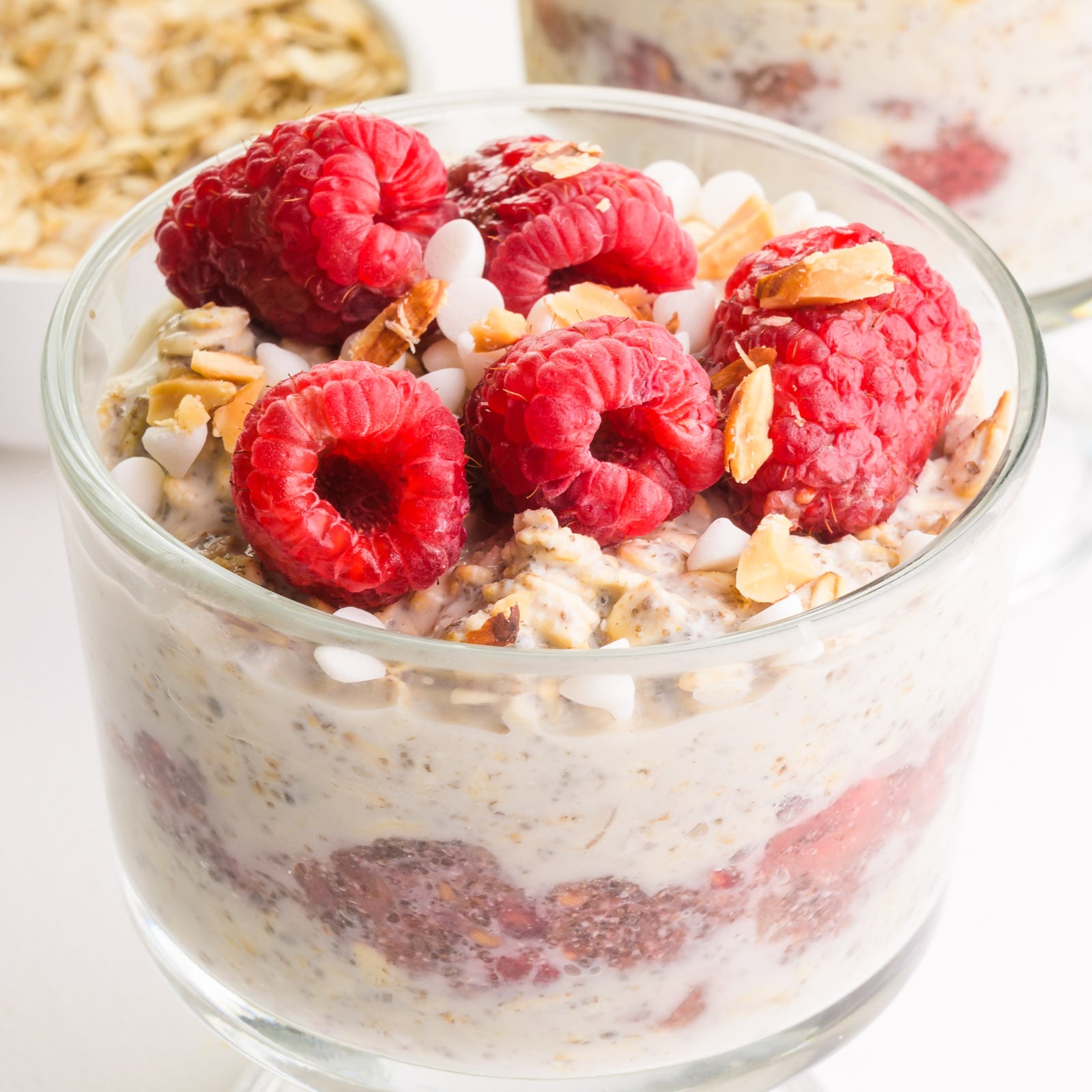 A closeup of a bowl of raspberry overnight oats.