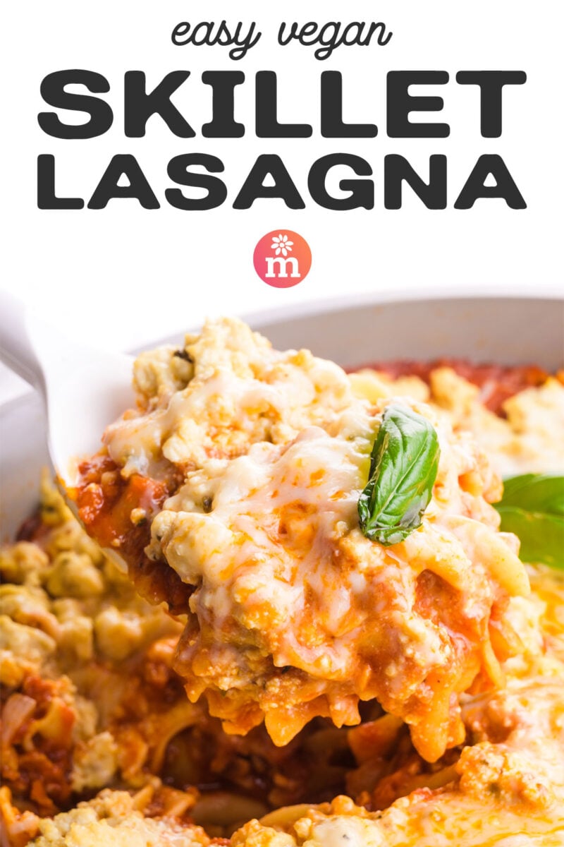 A serving of easy vegan skillet lasagna with melted cheese and fresh basil on top.