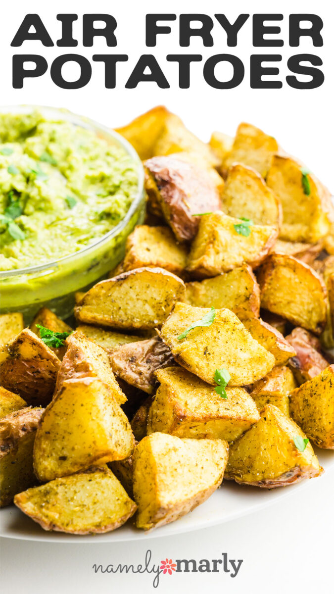 Crispy air-fried potatoes served with a creamy green dip, garnished with fresh herbs.
