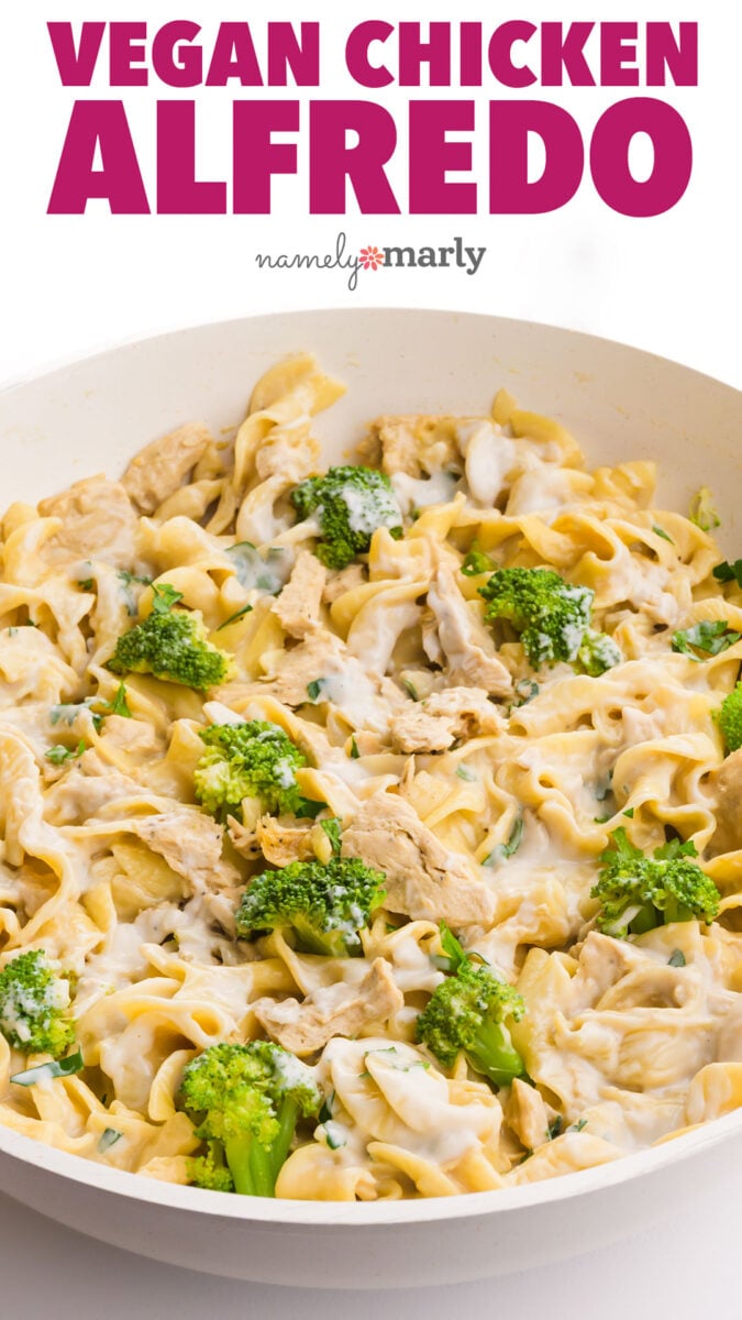 Pasta with vegan chicken and broccoli in a creamy sauce, garnished with fresh herbs.