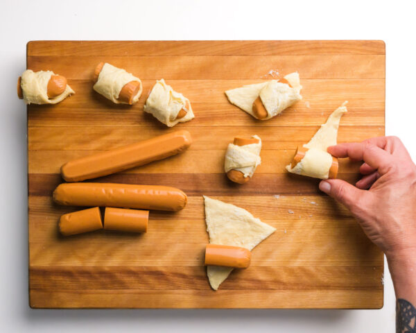 Vegan hot dogs are being wrapped with crescent rolls.