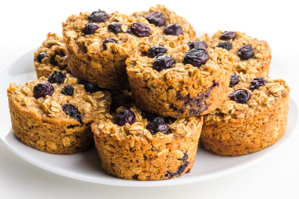 A plate holds several blueberry oat cups.